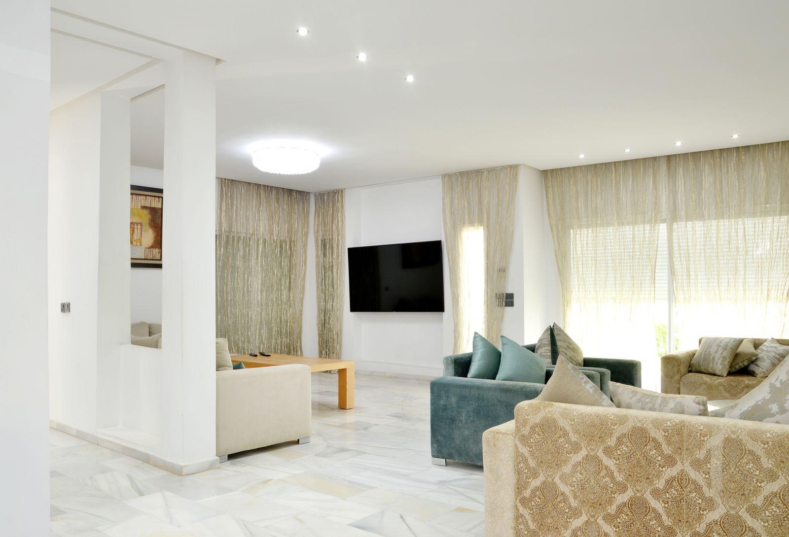 Spacious living room with elegant furnishings in an Ivory Court villa