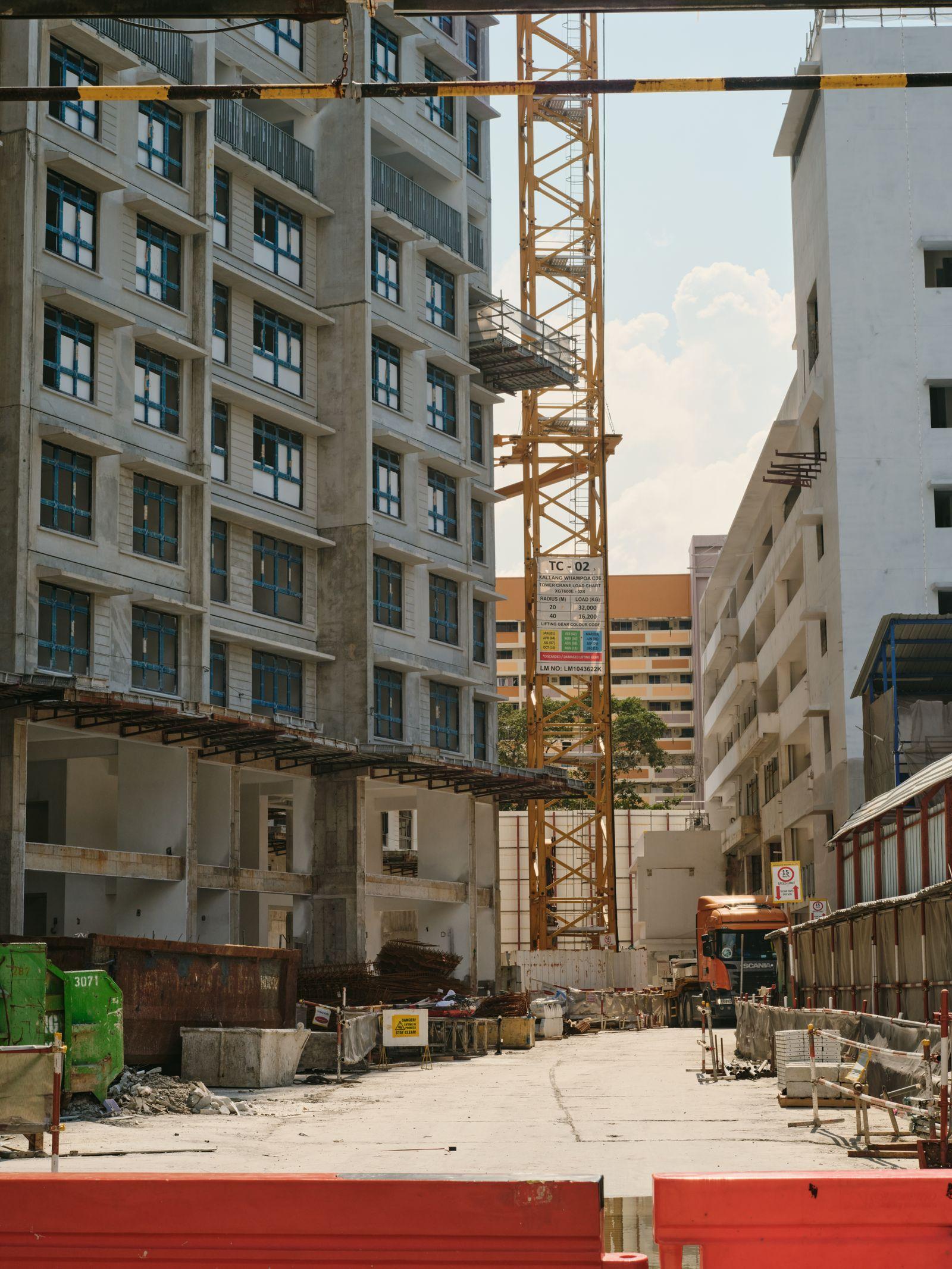 Urban construction site with tower crane at Palm Grove Estate