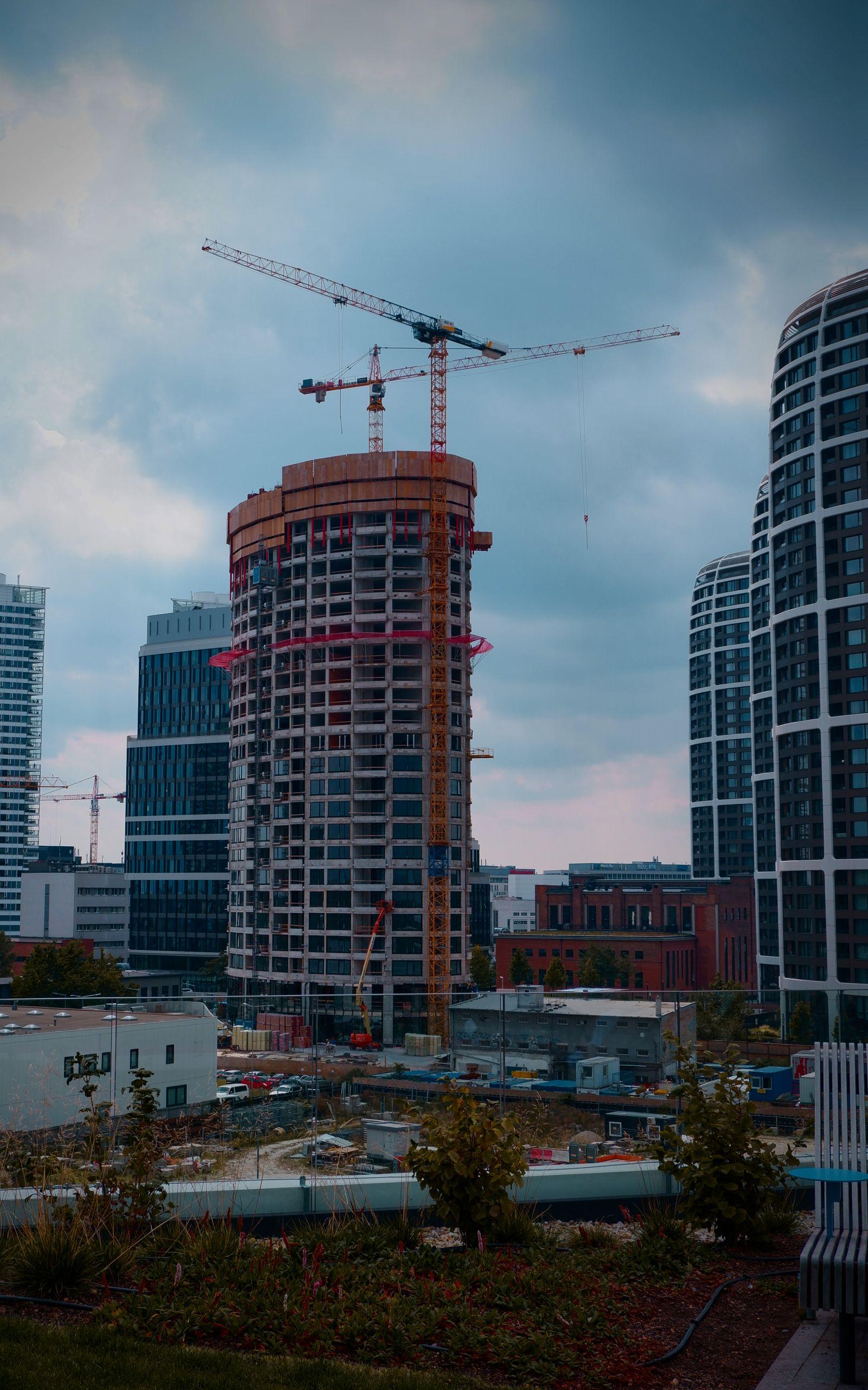 Construction site with skyscrapers and cranes near Skyline Towers
