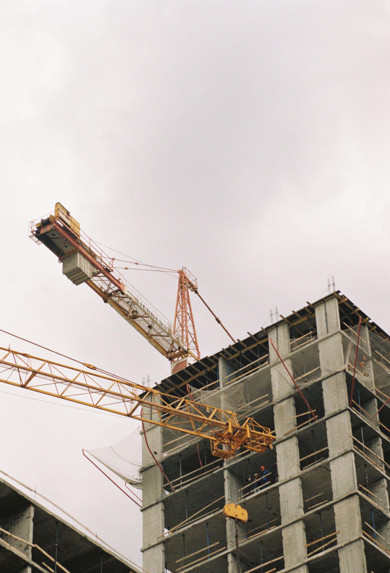 High-rise structure of The Aurelia under construction with tower crane