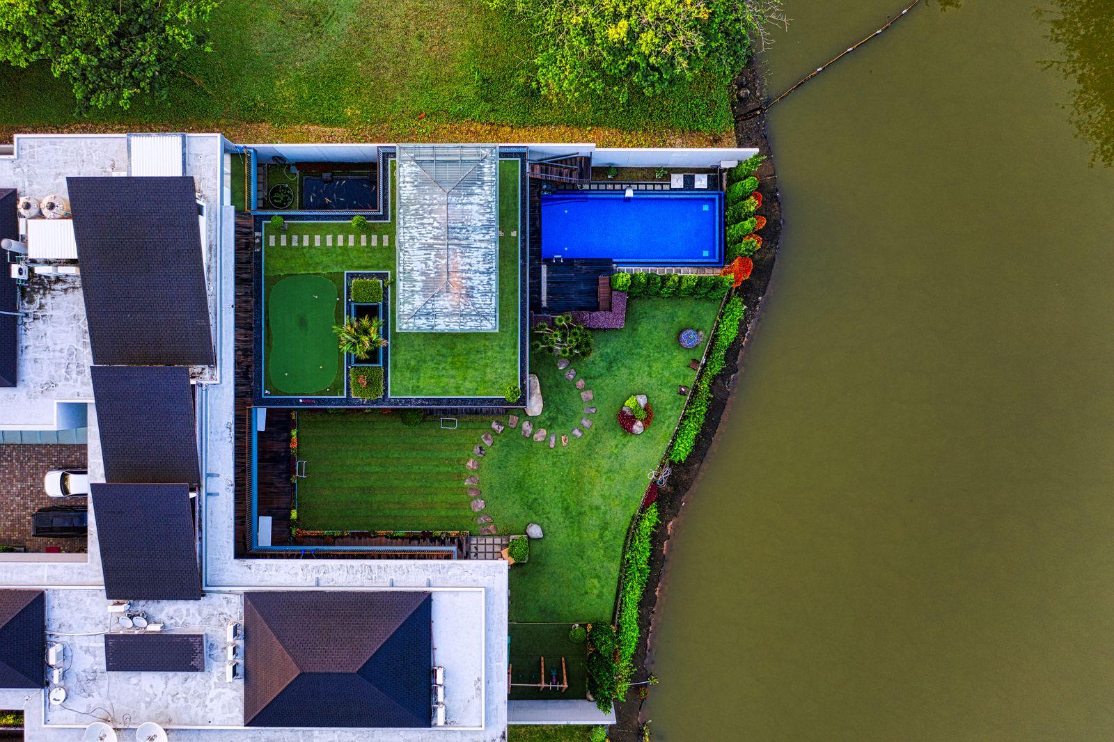 Concept image of a home with swimming pool planned for The Crescent estate