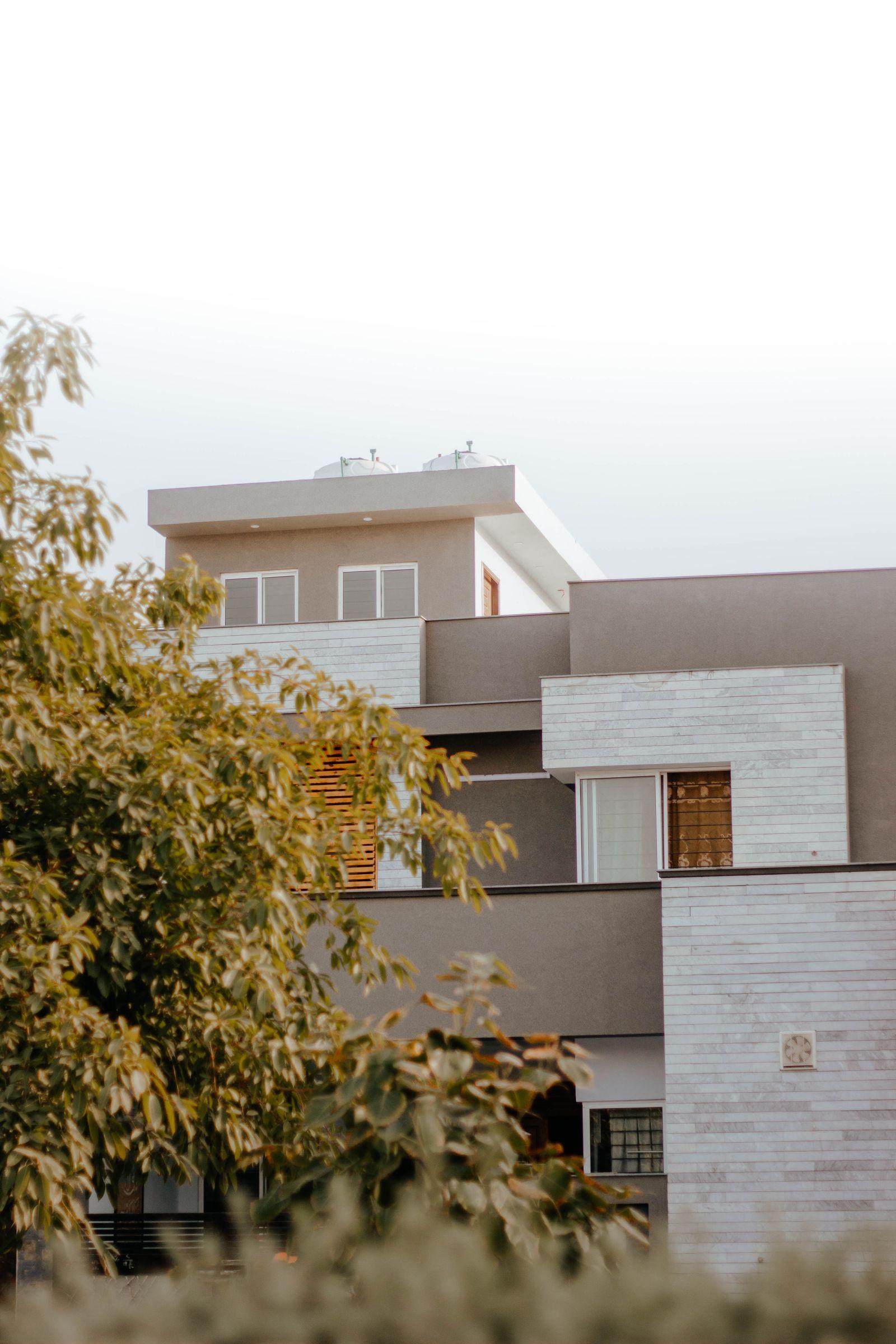 Artist's impression of a Whitestone Villas home set among mature trees